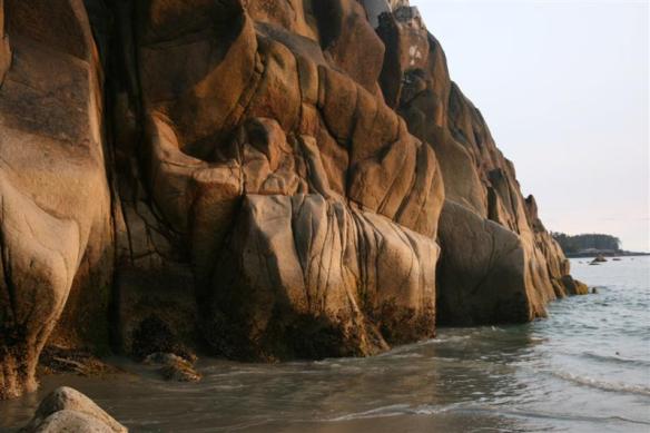 Wild looking coast, rocks sculpted by the water.