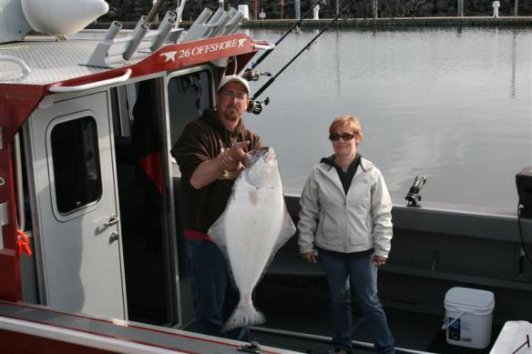 Happy couple with a beautiful fish!!