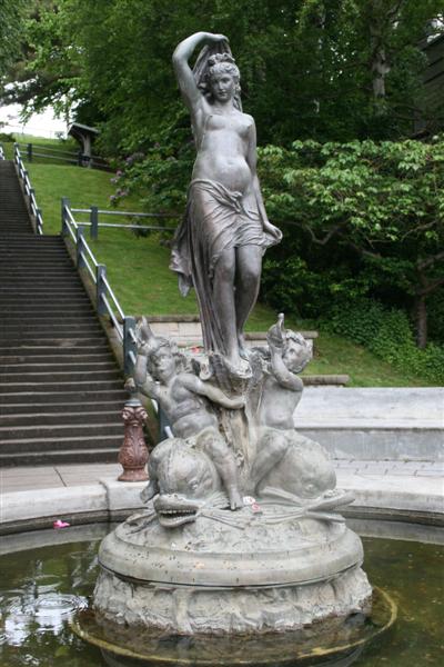 The beautiful statue in front of the stairs.