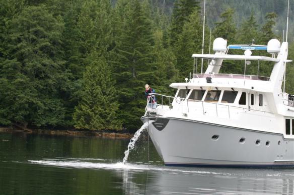 MV Meridian in Bodega Cove, Lisa , cleaning off the chain and anchor.