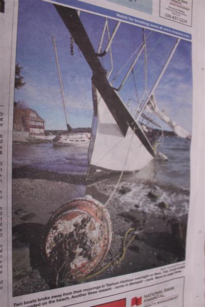 One of the boats, stranded on shore in Tsehum harbour,buoy and all.
